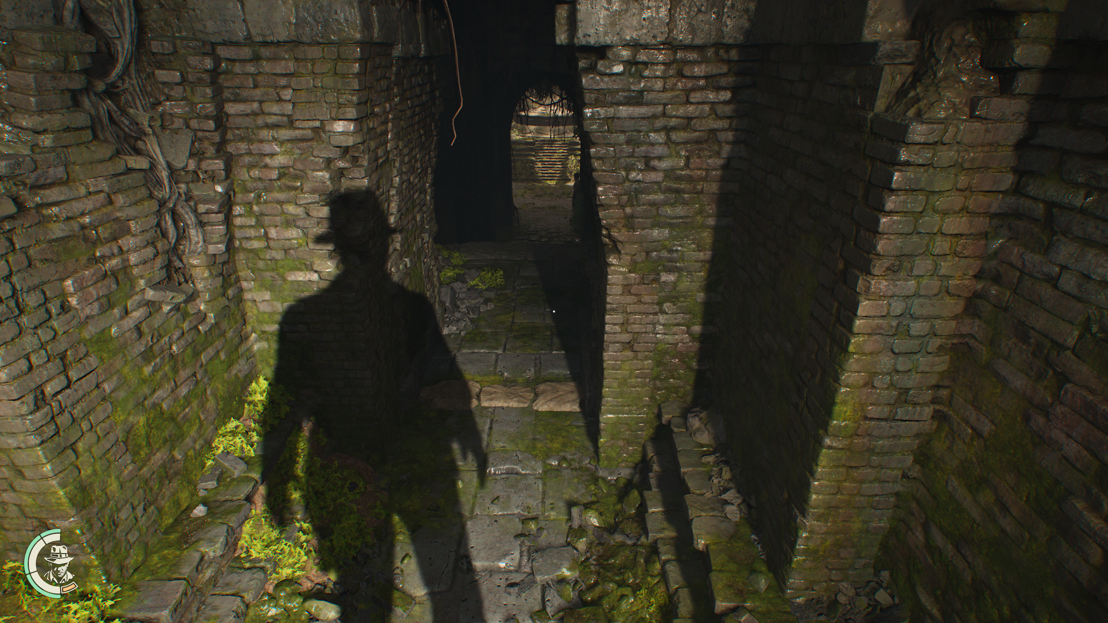 Screenshot of a shadow of Indiana Jones against a wall, wearing his distinctive fedora.