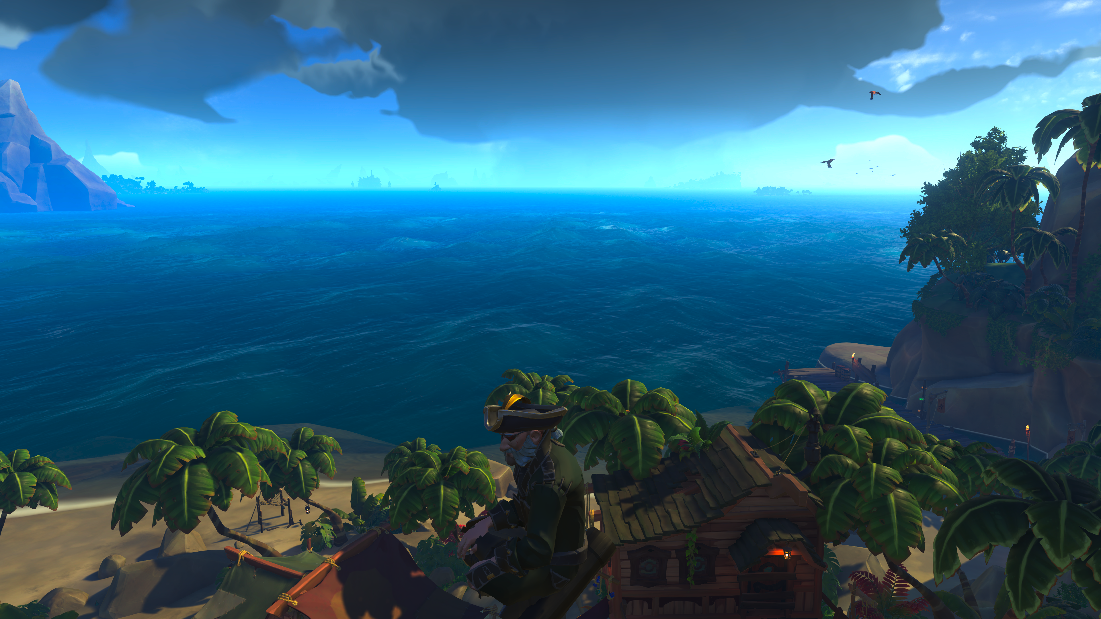 Screenshot from Sea of Thieves showing a pirate resting and taking in the view over the stunning sea.